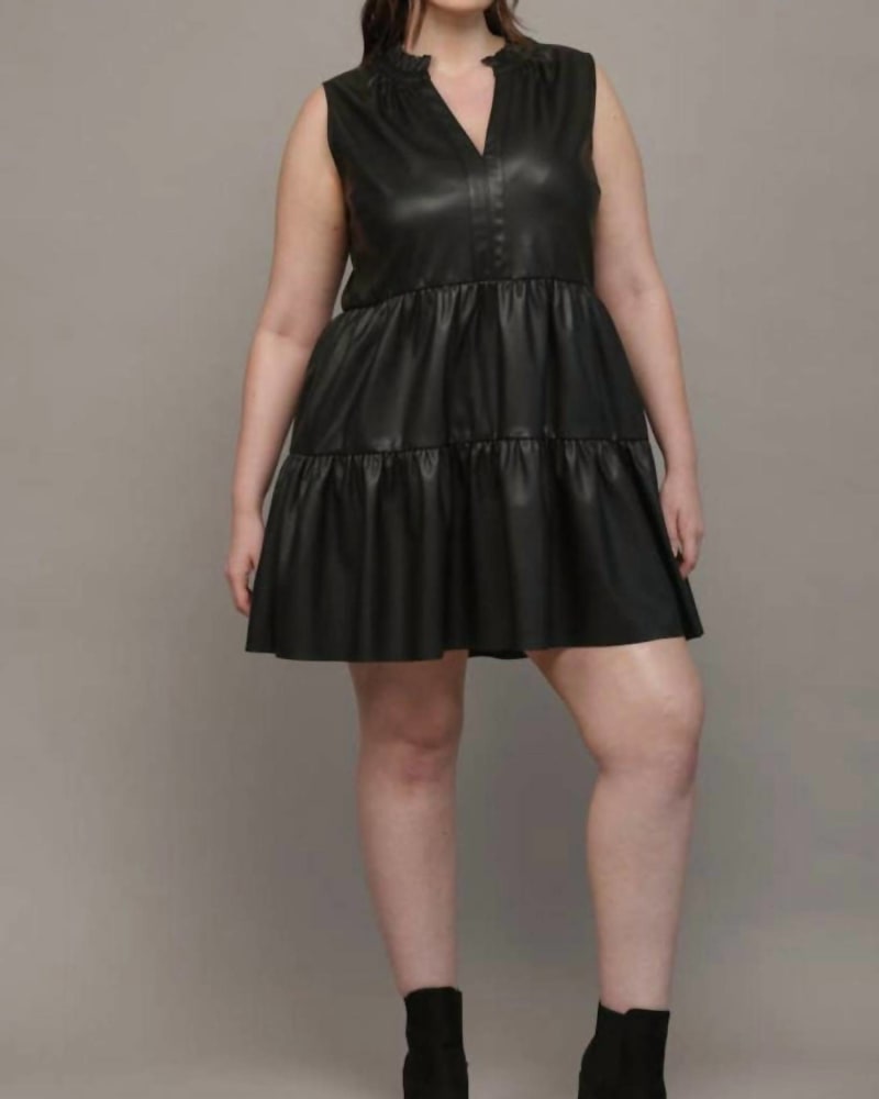 Front of a model wearing a size 1X Curves Are Cool Leather Tiered Dress In Black in Black by Fate. | dia_product_style_image_id:346504